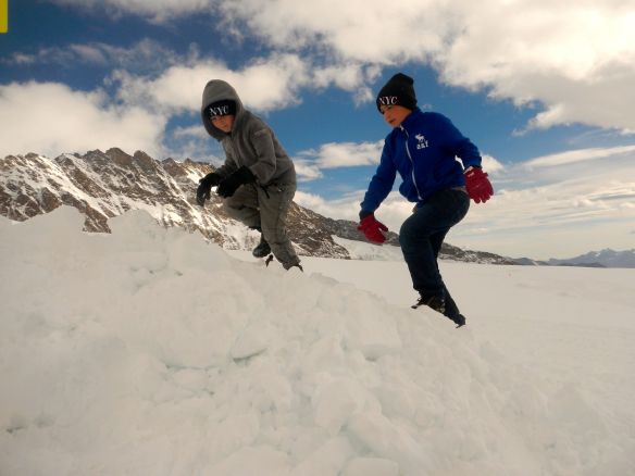 Two boys at the Jungfraujoch. This is a col between the Jungfrau and the Mönch. It lies at a height of 3,466 meters (11,371 ft) 