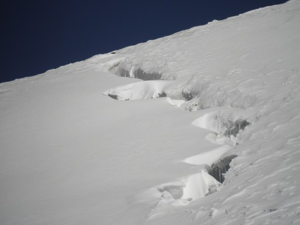 The snow gave way on me crossing a crevasse like this one. I yelled and Yannick ran forward so there was no slack in the rope and I did not go down further than my thighs.
