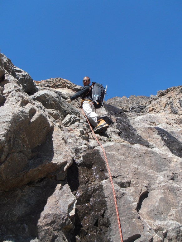 Yannick descending some steep rock